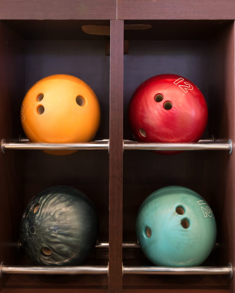 Bowling balls on the wooden shelf